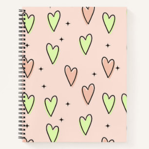 Cute hearts and stars pattern on pink notebook