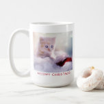 Cute Kitten Resting On a Santa Hat Meowy Christmas Coffee Mug<br><div class="desc">A mug with a photograph of a ginger kitten sitting on a soft white and red Santa hat. Blurry glittering lights bokeh background.
Funny pun - Meowy Christmas. Text is editable so you can change it so say whatever you like.</div>