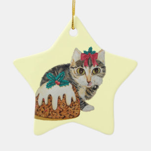cute kitten tabby cat eating pudding at christmas ceramic tree decoration