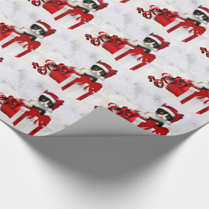 Cute Kitten with Holiday Package and Snow Wrapping Paper