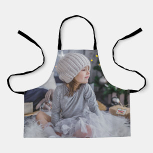 Cute little child girl and the Christmas tree .jp Apron