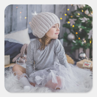Cute little child girl and the Christmas tree .jp Square Sticker