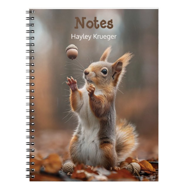 Cute little squirrel catching an acorn notebook (Front)