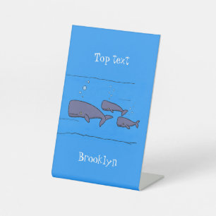 Cute migrating cartoon whales illustration pedestal sign