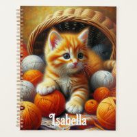 Cute Orange and White Kitten Playing in Yarn