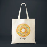 Cute Orange Watercolor Doughnut with Sprinkles Tote Bag<br><div class="desc">Cute Orange Watercolor Doughnut with Sprinkles Custom Tote Bag | Customisable tote bag featuring watercolor orange doughnut with colourful sprinkles. This cute doughnut tote bag will be perfect as a personalised gift. Personalise by adding a name or short phrase. Other doughnut colours are available.</div>
