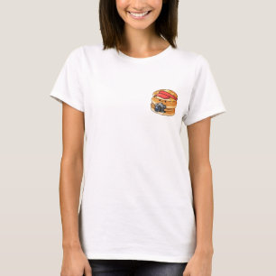 Cute Pancake Stack Character in Red Visor Holding T-Shirt