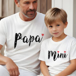 Cute Papa And Mini Fun Script And Heart T-Shirt<br><div class="desc">Delight your dynamic duo with our adorable "Papa & Mini" matching tees! Watch your little one beam with pride wearing a tee just like dad's. Ideal for birthdays, Father's Day, or simply celebrating your special bond any day of the year. It's the perfect surprise to strengthen that father-child connection! Our...</div>