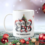 Cute Penguins in Red Santa Hats Family Christmas Coffee Mug<br><div class="desc">Create a unique personalised Christmas coffee mug that features a cute illustration of three penguins in red Santa hats having fun near a Christmas tree. It is perfect for winter Holidays and as a Christmas gift for family and friends.</div>