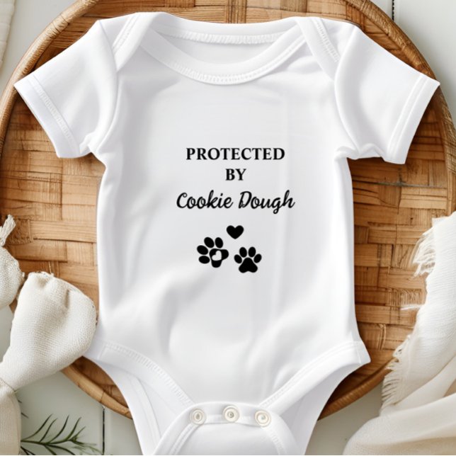 Cute Personalised Protected by Dog (Adorable baby bodysuit with "Protected by (Dog's Name)" design, featuring hearts and paw prints.)