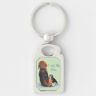 cute picture of puppy dog cuddling mum key ring