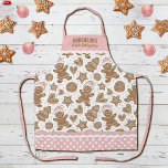 Cute Pink Christmas Cookie Baking Crew Apron<br><div class="desc">A cute holiday gingerbread cookie pattern decorates this Christmas cookie baking crew apron. Personalise it with your name. So Fun for Christmas baking! Border of apron has a pink and white polka dot pattern with ric rac. Makes a fun gift for Christmas. Designed for you by Blackberry Boulevard.</div>