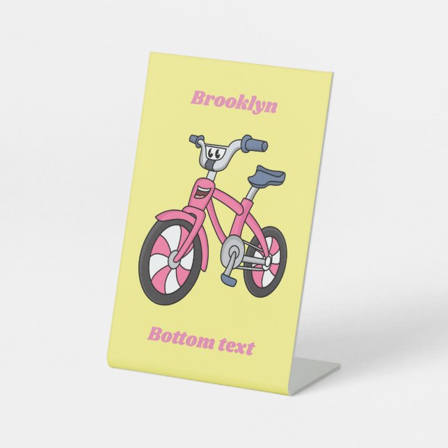 Cute pink kids bicycle cartoon illustration pedestal sign (Front)