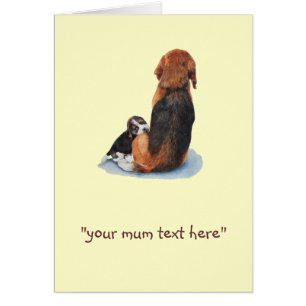 Cute puppy beagle cuddling mum dog