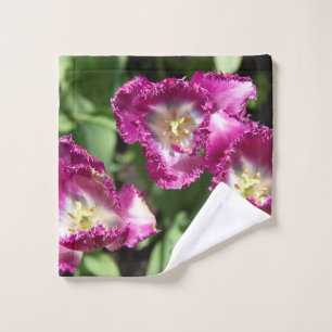 Cute purple tulips in the garden wash cloth