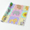 Cute quilt pattern on baby shower wrapping paper