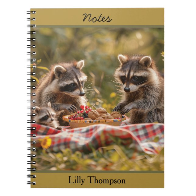 Cute raccoon family having a picnic notebook (Front)
