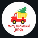 Cute red truck with Christmas tree small kid's Classic Round Sticker<br><div class="desc">Cute red truck with Christmas tree small kid's stickers. Also handy as envelope seals or gift wrapping sealers. Humourous toy drawing with custom greeting. Cute illustration with personalised name. Available in square and round shape. Fun design for children. Merry Christmas! Happy Holidays!</div>