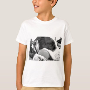 cute sad looking pitbull dog black white with ball T-Shirt