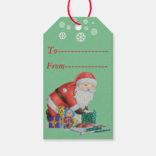 Cute santa and toys wrapping Christmas gifts Gift Tags