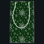 Cute Silver Grey Christmas Snowflakes on Green   Small Gift Bag<br><div class="desc">Mixed sized pretty silver grey snowflakes are scattered throughout this Christmas seasonal pattern. This cute festive design with a green background is sure to please any age and perfect for anyone who likes traditional xmas patterns.</div>