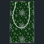 Cute Silver Grey Christmas Snowflakes on Green   Small Gift Bag<br><div class="desc">Mixed sized pretty silver grey snowflakes are scattered throughout this Christmas seasonal pattern. This cute festive design with a green background is sure to please any age and perfect for anyone who likes traditional xmas patterns.</div>