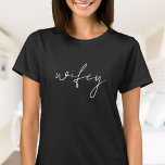 Cute Simple Wifey | White Script, black T-Shirt<br><div class="desc">Celebrate love and the future Mrs. with this stylish "Wifey" T-shirt! Designed with a modern black script, this cute and simple tee is perfect for bridal showers, bachelorette parties, or as a thoughtful wedding gift. Made from soft, comfortable fabric, it’s ideal for wearing during pre-wedding festivities or even as a...</div>
