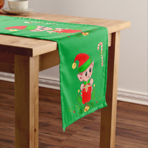 Cute snowman and golden ball on green medium table runner