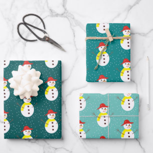 Cute snowman and snow on teal blue wrapping paper sheet