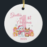 Cute Snowman Baby Girl's First Christmas Ornament<br><div class="desc">Celebrate a cherished milestone with this adorable Baby Girl's First Christmas ornament! Featuring a sweet pink "1st Christmas" design with a smiling snowman in a Santa hat, a cute baby reindeer with a pink bow, and festive gift boxes, this charming ornament makes the perfect keepsake for new parents. A delightful...</div>