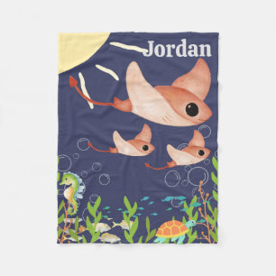 Cute stingrays in a deep blue sea, fleece blanket