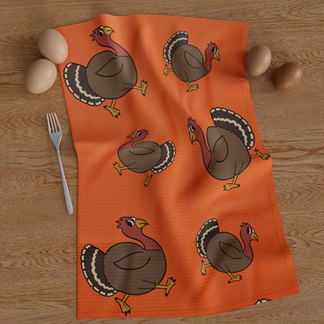 Cute Thanksgiving Turkeys Orange Kitchen Towel (A fun thanksgiving turkey trotting along on this orange kitchen towel with his pals)