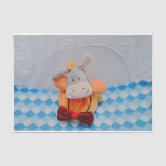 Cute toy with a red bowtie tissue paper