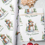 Cute Watercolor Modern Red Green Snowman Christmas Wrapping Paper<br><div class="desc">Dress every gift in storybook charm with this whimsical evergreen snowman design. A cheerful snowman in a green hat with a red band, red-and-green striped scarf, and classic coal buttons stands before snowy pine trees under drifting snowflakes. The soft watercolor textures, sage and mint green pine forest accents, and airy...</div>