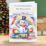 Cute Watercolor Snowman Merry Christmas Teacher<br><div class="desc">Celebrate your favourite teacher this season with this charming personalised Christmas card! This whimsical design features a cheerful snowman with books, apples and a rainbow, in a watercolor style. The front includes a festive "Merry Christmas" greeting in script typography, and space to personalise with your teacher’s name. Below the picture,...</div>