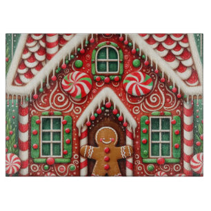 Cute, whimsical gingerbread man & house cutting board