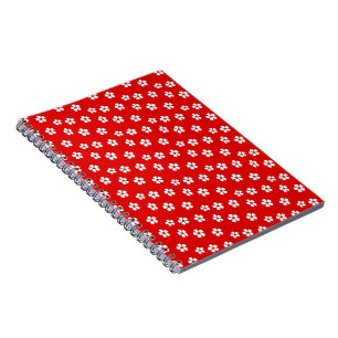 Cute white flowers on red notebook