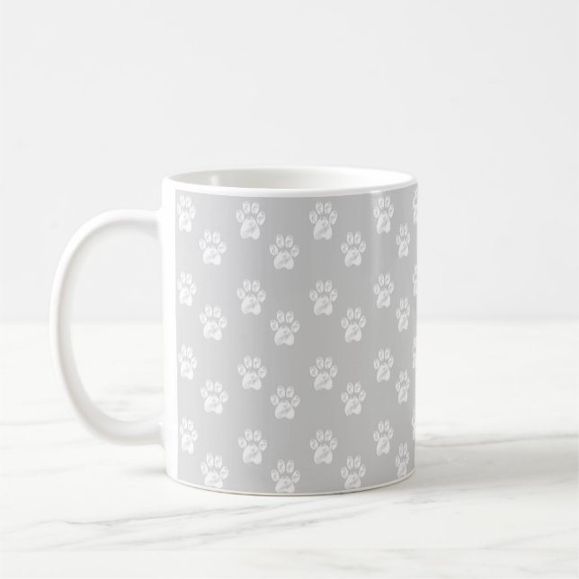Cute white paws on silver grey coffee mug (Left)