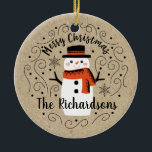 Cute Winter Christmas Snowman Ceramic Tree Decoration<br><div class="desc">A cute Christmas snowman with the words Merry Christmas decorates this ornament. Personalise it with your family name. A fun accent for the Christmas holiday season. Designed for you by Blackberry Boulevard.</div>