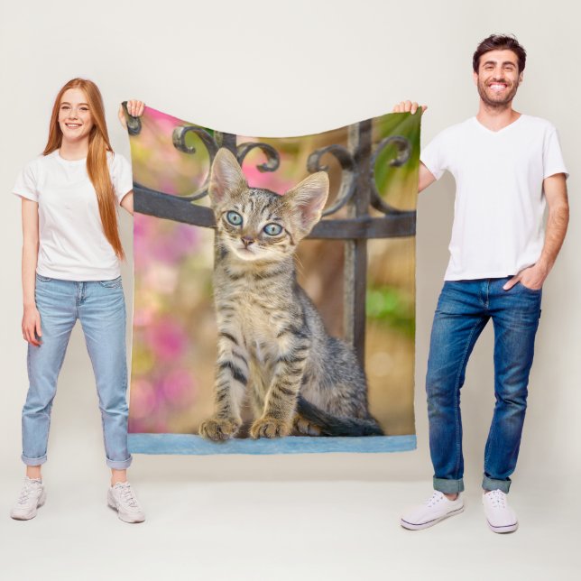 Cute Young Tabby Kitten with Blue Eyes in a Garden Fleece Blanket (In Situ)