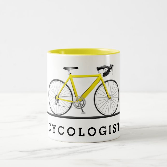 Cycologist text and yellow bicycle Two-Tone coffee mug (Center)