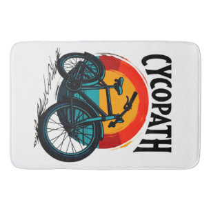 Cycopath: Energetic Bike with sunset Graphic Tee Bath Mat
