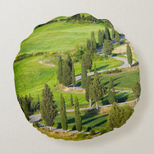 Cypress lined winding road in Tuscany round pillow