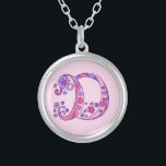 D monogram decorative letter necklace<br><div class="desc">Pretty letter D monogram pendant. Whimsical letter drawing of the capital initial letter D ideal for gifting girls with a name that begins with D. Background colour can be changed if required,  currently light pink. © Original drawing and design by Sarah Trett www.sarahtrett.com for www.mylittleeden.com</div>