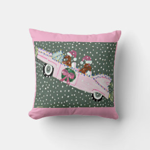 Dachshunds at Christmas in a pink convertible Cushion