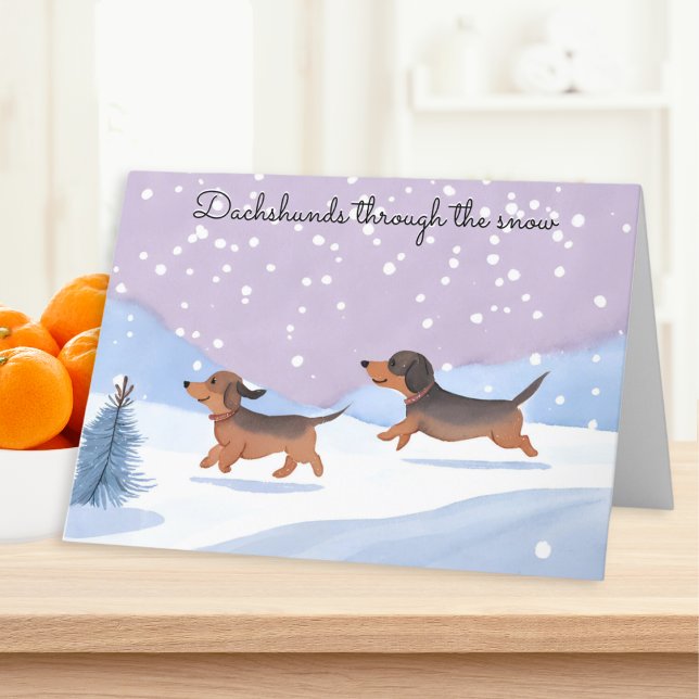 Dachshunds Through The Snow Sausage Dog Christmas Holiday Card (A Christmas card with picture of two cute sausage dogs and caption 'Dachshunds through the snow')