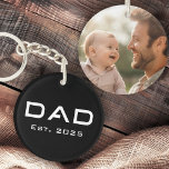 Dad est year father's day new baby photo black key ring<br><div class="desc">Keychain featuring the text "Dad" in a modern font with the est year below. On the back is a customisable photo template. Default colours are black and white but all colours can be customised in the design tool.</div>