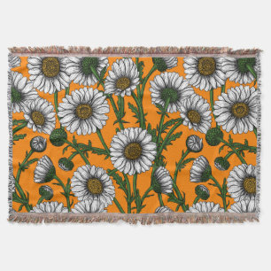Daisies on orange throw blanket