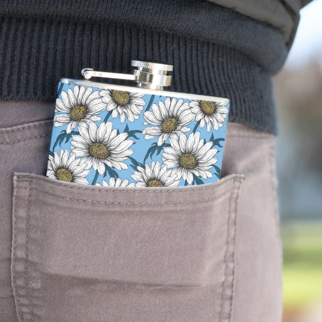 Daisies, wild flowers on blue hip flask (In Situ)