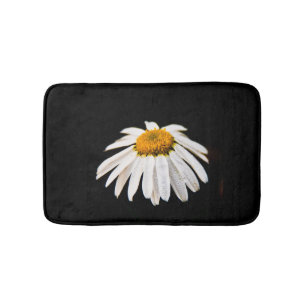 Daisy on black background bath mat